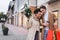 amazed interracial couple with coffee to