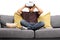 Amazed little boy sitting on a couch and using virtual reality g