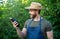 amazed man greengrocer in straw hat with eggplant vegetable