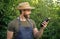 amazed man greengrocer in straw hat with eggplant vegetable