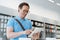 Amazed man smiling while testing mockup digital tablet