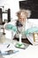 Amazed senior scientist with foaming beaker