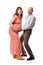 Amazed or surprised parents holding pregnant woman abdomen