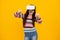 Amazed teenager. Virtual gadgets for kids, free time and study. Teenage girl uses vr glasses, isolated on yellow