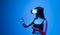 Amazed woman getting experience using glasses of virtual reality and exploring a virtual world. Girl spend shes time in