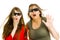 Amazed woman and girl in cinema wearing 3D glasses experiencing 5D cinema effect - scared watching performance - gestures of