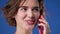 Amazed woman have pleasant talk with friend by phone, communication at distance, nice joke, lady surprising sincerely on