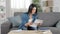 Amazed woman reading a letter at home