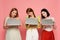 Amazed women holding laptops isolated on