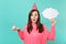 Amazed young woman in birthday hat hold in hand cake with candle, empty blank Say cloud speech bubble for promotional