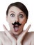 Amazed young woman with moustache; isolated