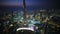 Amazing aerial drone panorama flight over futuristic buildings in night light Dubai skyline