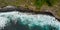 Amazing aerial view of crashing waves on rocks seascape.