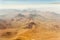 Amazing airplane window view when crossing the high Andes volcanoes on the border of Chile and Argentina