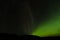 Amazing aurora borealis made in iceland, incredible patterns cover the sky, green light plays with unusual patterns