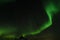 Amazing aurora borealis made in iceland, incredible patterns cover the sky, green light plays with unusual patterns