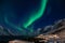 Amazing Aurora Borealis in North Norway Kvaloya, mountains in the background