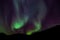Amazing Aurora Borealis in North Norway, mountains in the background