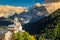 Amazing autumn landscape with church on the hill, Dolomites, Italy