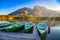 Amazing autumn scenery on Hintersee lake with boats moored on wooden pier, Bavaria, Germany