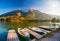 Amazing autumn scenery on Hintersee lake with boats moored on wooden pier, Bavaria, Germany