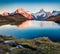 Amazing autumn sunrise on Bachsee lake with Wetterhorn and Wellhorn peaks on background. Colorful autumn morning in Bernese Oberla