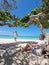 Amazing Baby Beach and coast on Aruba, Caribbean, white beach with blue ocean tropical beach, couple man and woman mid