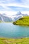 Amazing Bachalpsee lake in the Swiss Alps photographed with famous mountain peaks Eiger, Jungfrau, and Monch. Alpine lake and