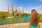 Amazing back view of attractive beautiful woman looking at Cathedral Basilica of Our Lady of the Pillar  in Zaragoza, Spain