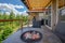 Amazing balcony patio with fire pit and forest and mountains view. Dream come true home exterior. New AMerican architecture.