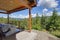 Amazing balcony patio with fire pit and forest and mountains view. Dream come true home exterior. New AMerican architecture.