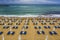 Amazing beach with, blue lounge chairs, with umbrellas