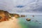 Amazing beach at sunrise. Algarve in the south of Portugal is a travel vacation destination for many tourists. Beautiful cliffs, c