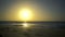 Amazing beautiful sunset on the sea or ocean. Clear sky. The calm sea with small waves. Waves rippling over sand. View