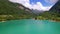 Amazing beautiful turquoise lake Tenno in Trentino region of Italy, aerial drone video with