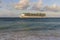 Amazing beauty  Atlantic ocean turquoise water surface. Big cruise boat merging with blue sky and white clouds.