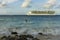 Amazing beauty  Atlantic ocean turquoise water surface. Big cruise boat merging with blue sky and white clouds.