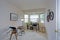 Amazing beige home office interior with a bay window.