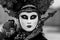 Amazing black and white portrait with venetian mask during venice carnival