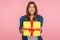 Amazing bonus, holiday present! Portrait of extremely happy girl in checkered shirt holding wrapped box