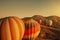 Amazing Cappadocia rocky landscape and balloons at sunrise, view of the valley and canyons