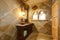 Amazing castle style bathroom with an arch window