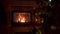 Amazing Christmas tree blinking colorful lights garland near fireplace with burning fire log