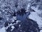 Amazing Cinematic Aerial View On Freezing River. Aerial View Flight Above Frozen Creek Scenic View Of Nature
