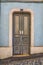 Amazing classic gray wooden door with decorative details. Front view