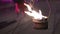 Amazing closeup of bowl with flame. Dancing fire, fiery performance.