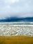 Amazing clouds sky over wave in the sea