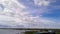 Amazing cloudy sky over the lake. Three old boats were moored to the shore. Fantastic skies. Calming landscape. 