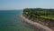 Amazing coastline aerial view scenery in Brodten, Germany, baltic sea, clear sky day, drone flying forward