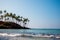 Amazing Coconut palm hill in Mirissa bay in Sri lanka. Palms silhouette over blue ocean beach